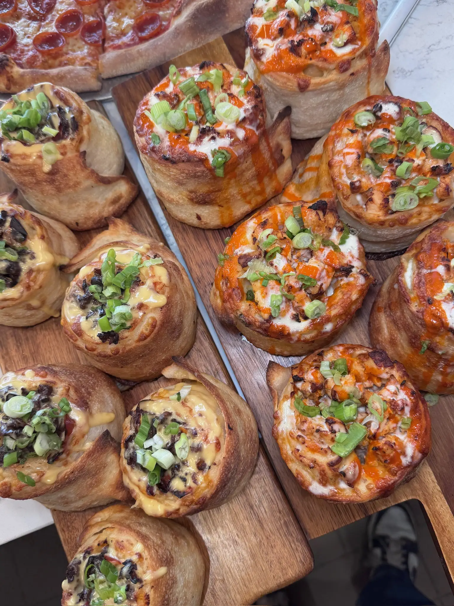 Crustinos Pizza’s signature spread of pizzas and focaccia, crafted with authentic Italian flavors.